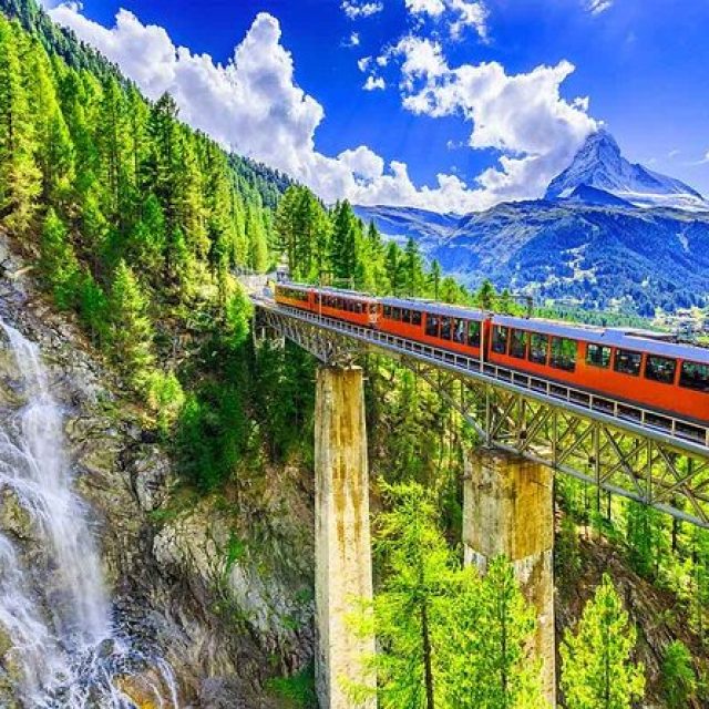 Taking a scenic train ride through the Swiss Alps.
